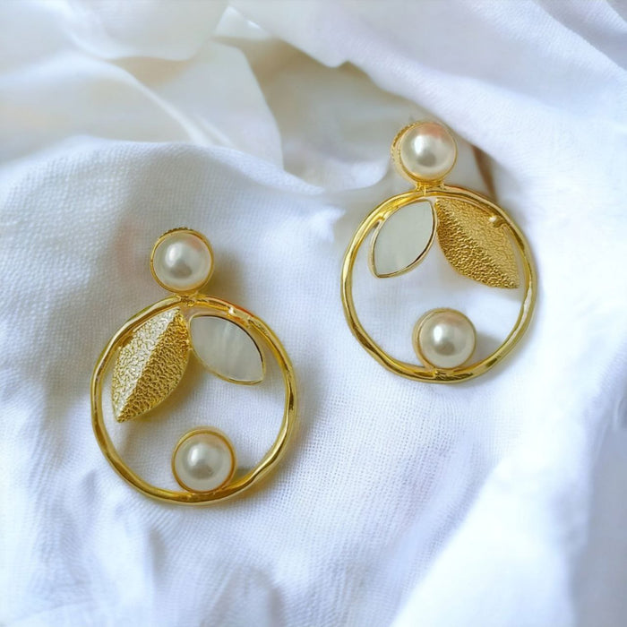 Pearl Elegance circular golden earring with graceful leaf and white stone accent